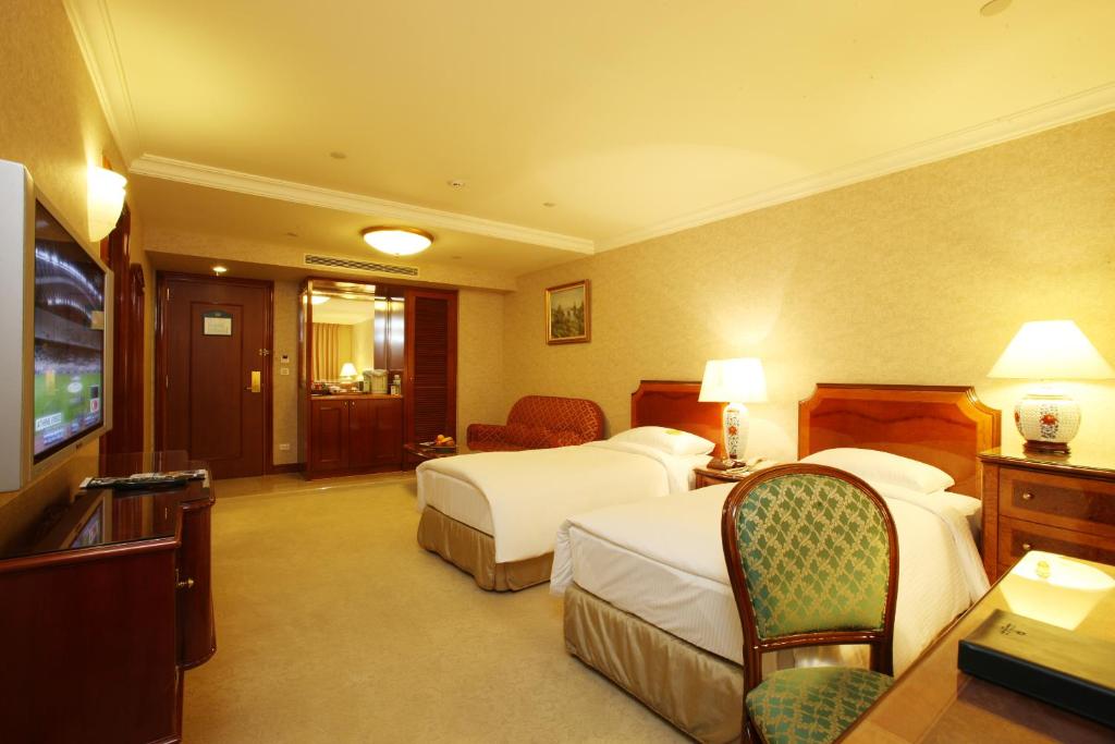 Postel nebo postele na pokoji v ubytování Evergreen Laurel Hotel Taipei