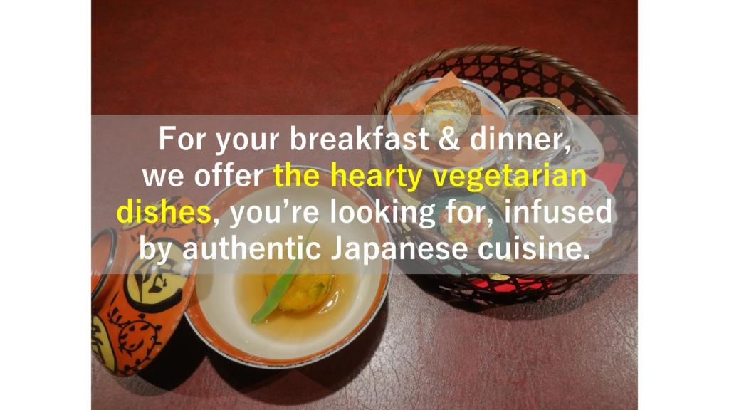 a bowl of food on a table with a bowl of food at IZUNA INN & SPA - the veggie delights in Ito