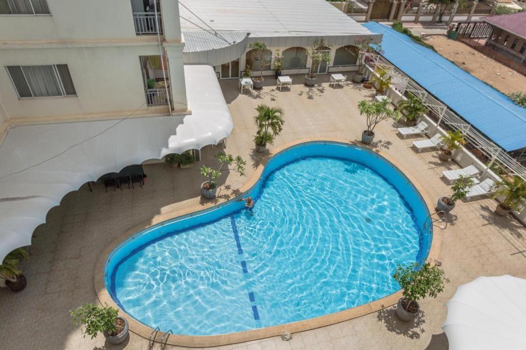 an overhead view of a large swimming pool in a hotel at Mekong View Hotel in Phnom Penh
