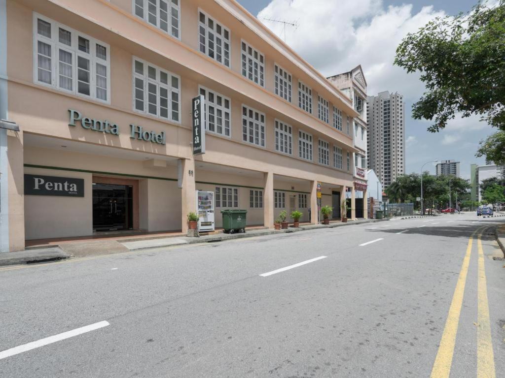 an empty street in front of a building at Penta Hotel in Singapore