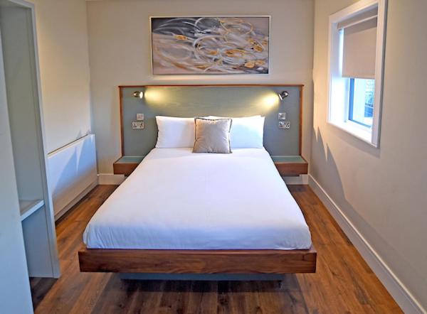 Postel nebo postele na pokoji v ubytování Moy Hotel