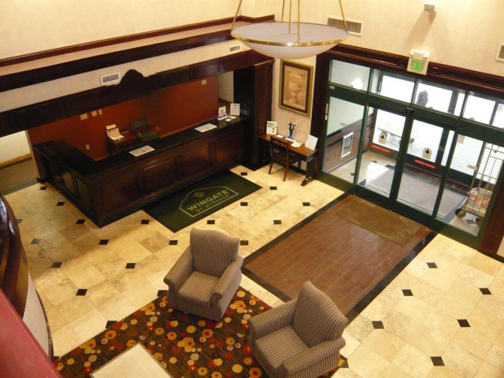 an overhead view of a living room with a piano and chairs at Streetsboro/Cleveland Southeast in Streetsboro