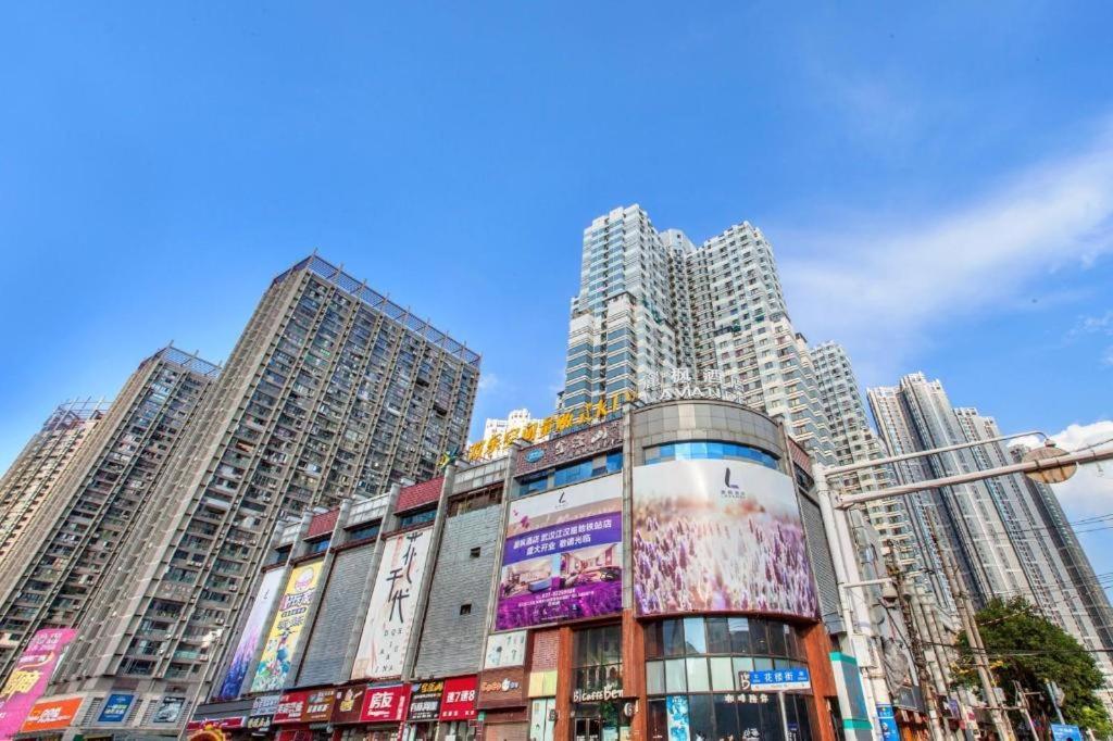 a group of tall buildings in a city at Lavande Hotel Wuhan Jianghan Road Subway Station in Wuhan