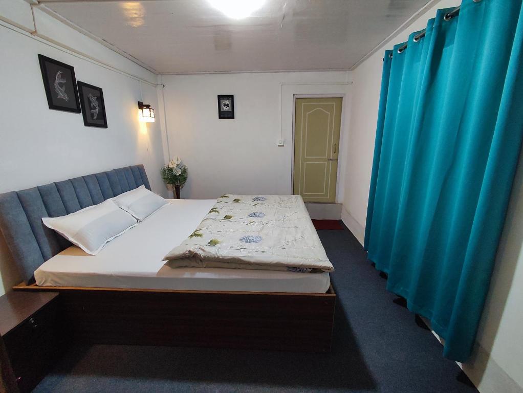 Postel nebo postele na pokoji v ubytování Haven Eleven Homestay