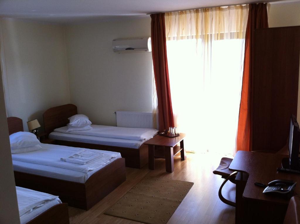 Postel nebo postele na pokoji v ubytování JRB Hotel