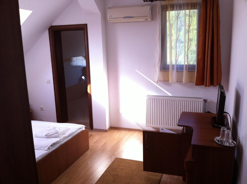 Postel nebo postele na pokoji v ubytování JRB Hotel