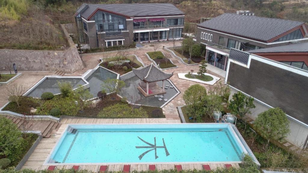 an aerial view of a house with a swimming pool at Tiantai He hotel in Tiantai