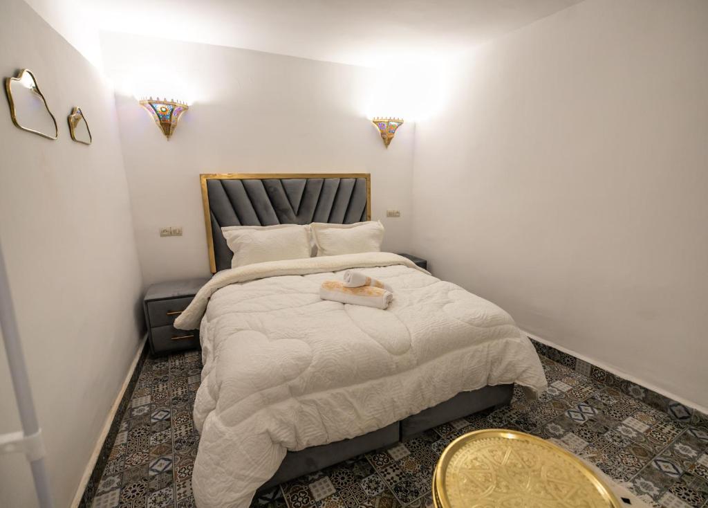 Postel nebo postele na pokoji v ubytování Riad Fes Lile