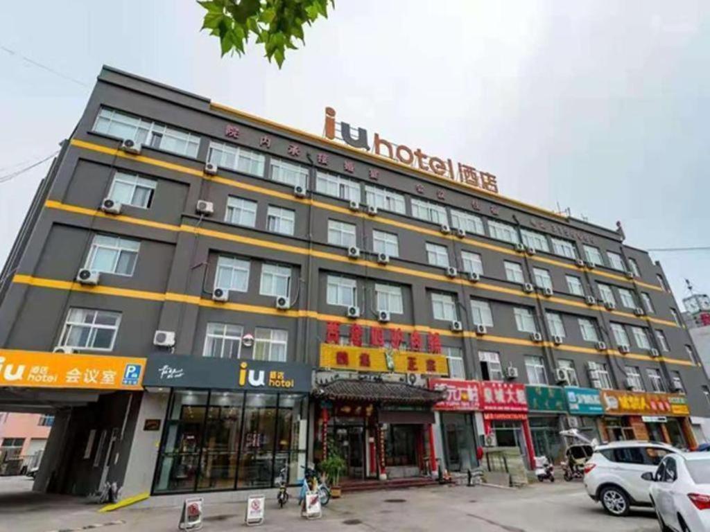 a large black building with a lot of windows at IU Hotel Binzhou University in Binzhou