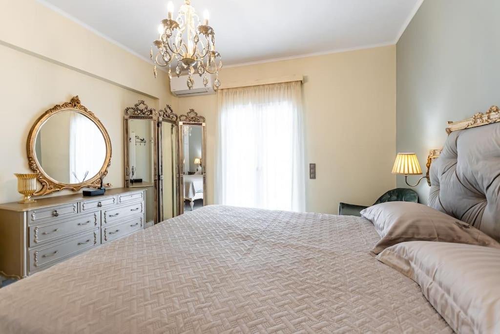 Postel nebo postele na pokoji v ubytování Mythodea Luxury Villa