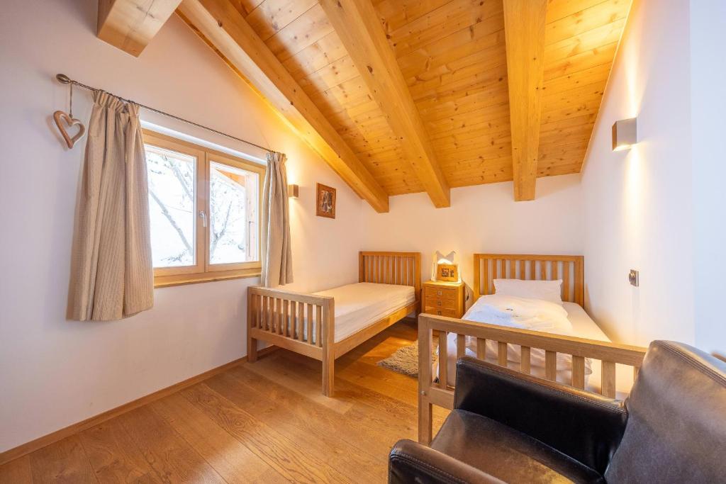 Postel nebo postele na pokoji v ubytování Chalet Enchanteur