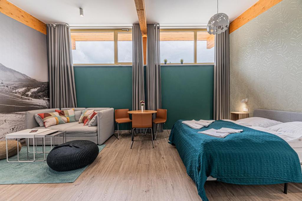 Postel nebo postele na pokoji v ubytování MEANDER THERMAL & SKI REZORT ORAVICE