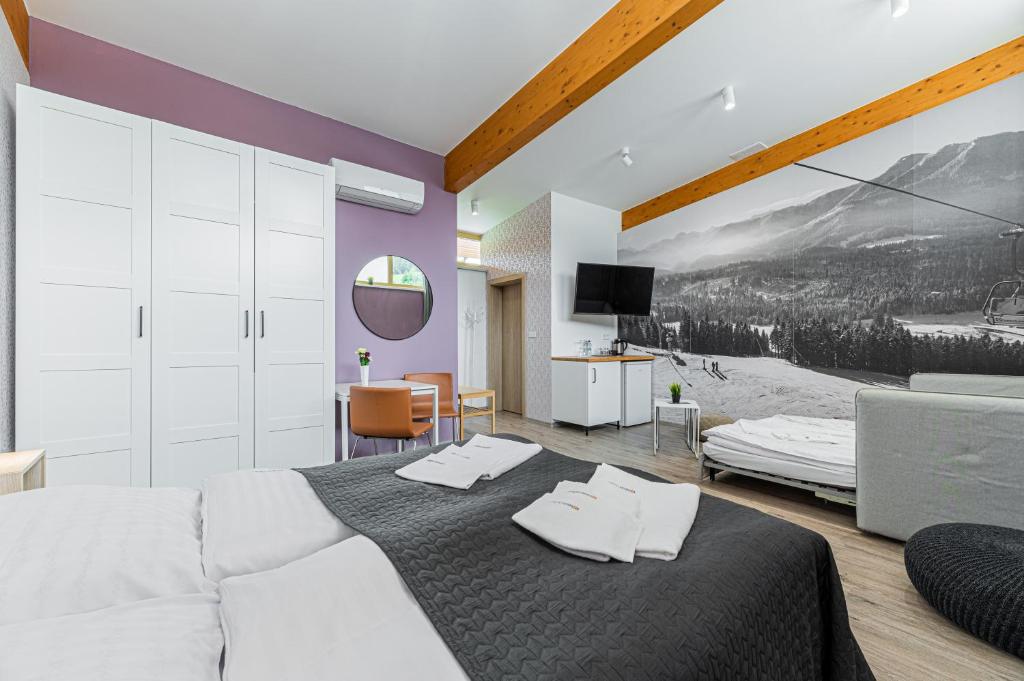 Postel nebo postele na pokoji v ubytování MEANDER THERMAL & SKI REZORT ORAVICE