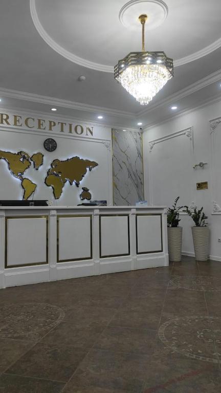 a room with a map of the world on the wall at Tanzharyk Hotel in Aktobe