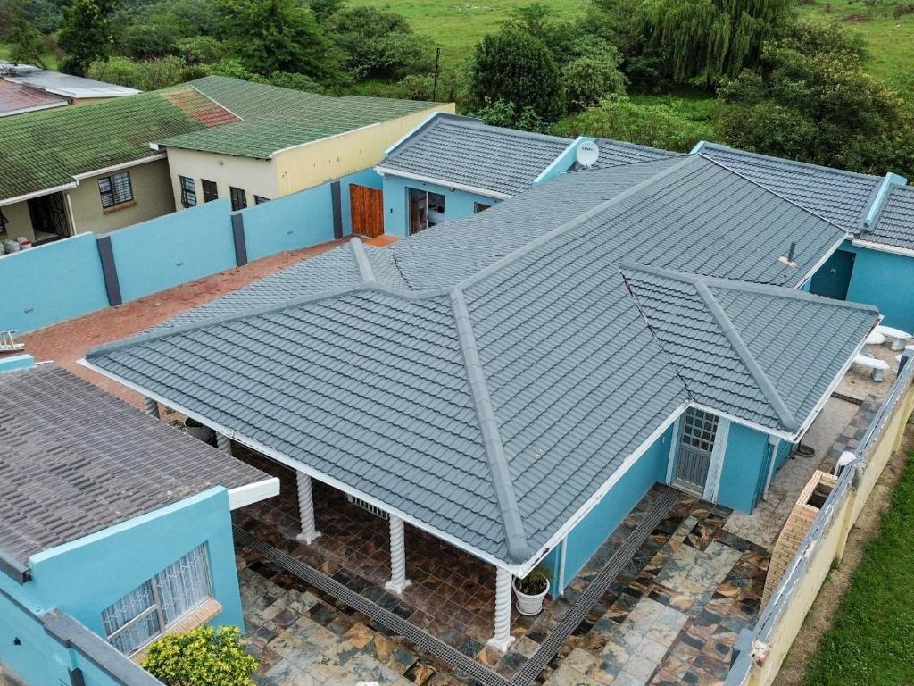 an overhead view of a house with blue roofs at Elam Guest House in Mthatha