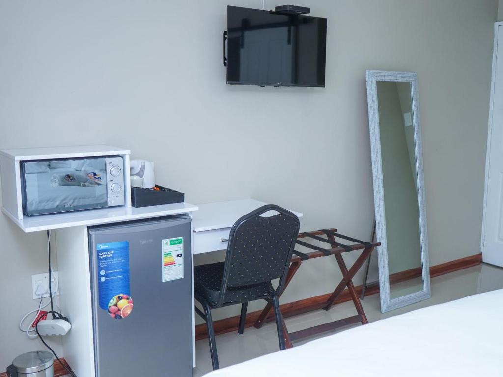 TV o dispositivi per l'intrattenimento presso Elam Guest House