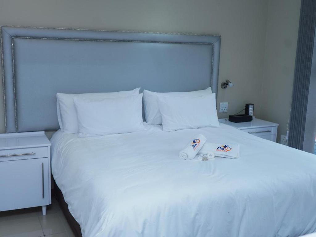 Letto o letti in una camera di Elam Guest House