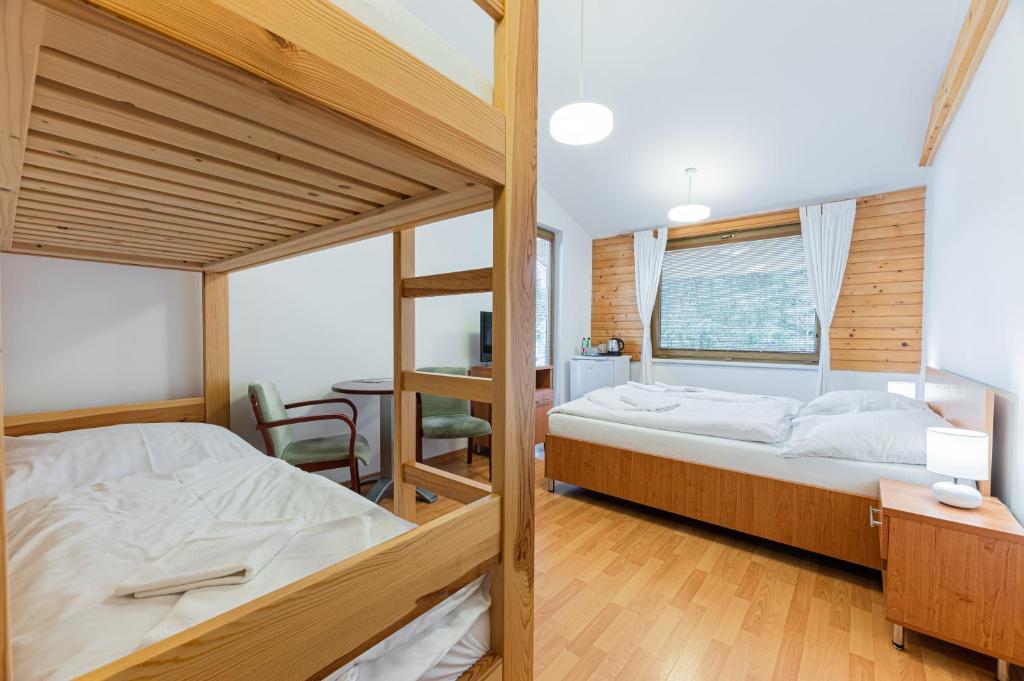 Postel nebo postele na pokoji v ubytování MEANDER THERMAL & SKI REZORT ORAVICE