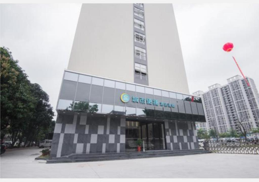 a building with a sign on it in a city at City Comfort Inn Shantou Daxue Road in Shantou