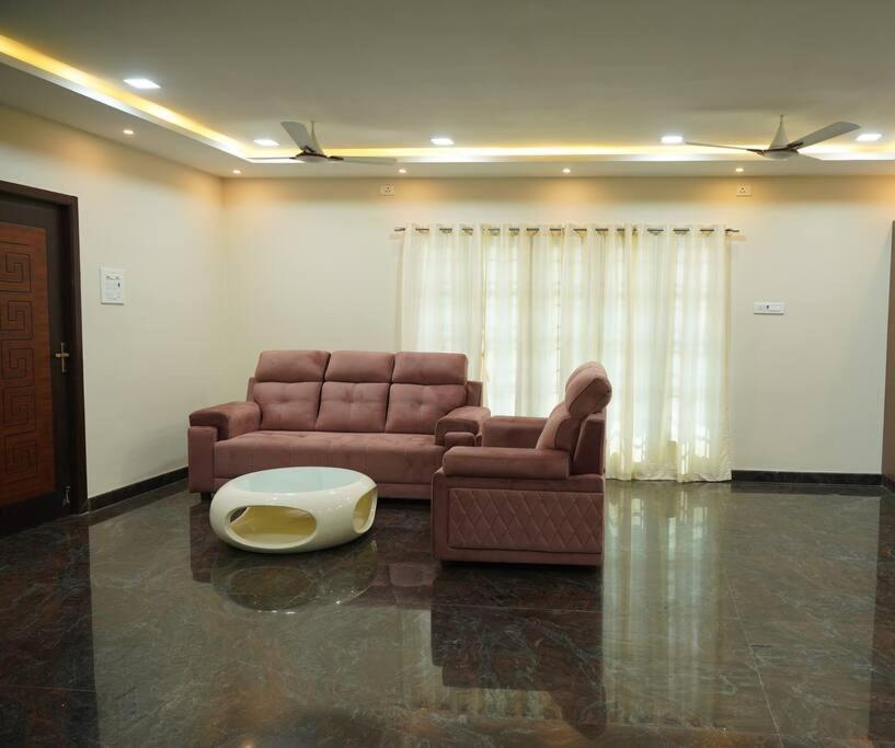 Uma área de estar em Homestay at OMR, Chennai