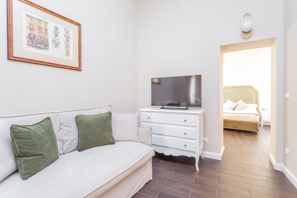 Postel nebo postele na pokoji v ubytování Daplace - La Mongolfiera Rooms in Navona