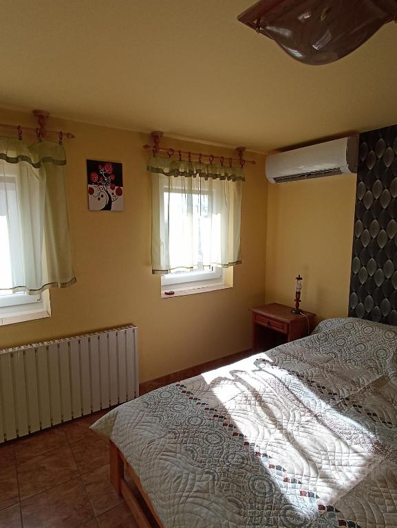 Posteľ alebo postele v izbe v ubytovaní Ginkgo Apartman