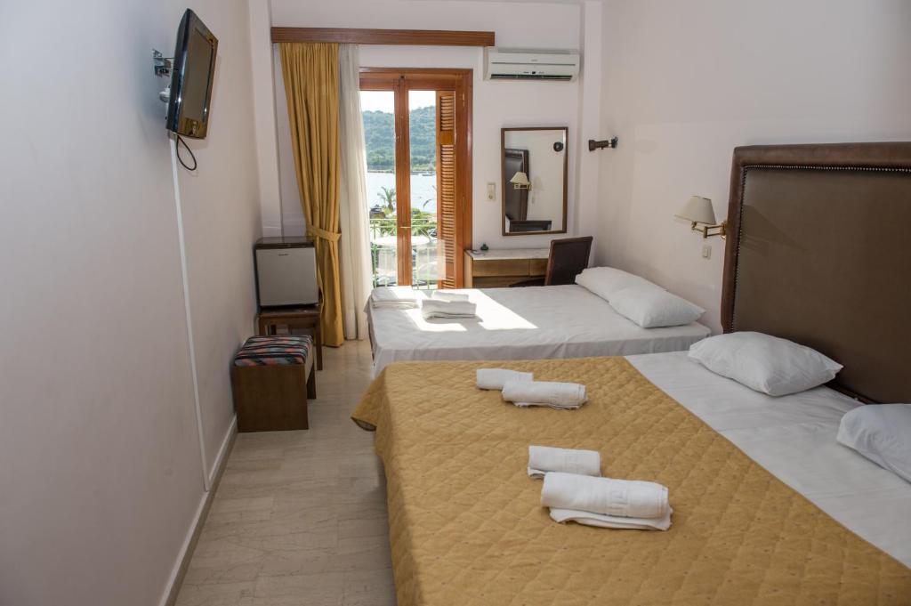 Postel nebo postele na pokoji v ubytování Verdelis Inn