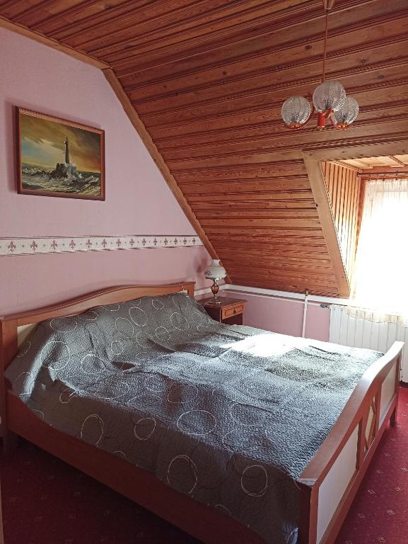 Posteľ alebo postele v izbe v ubytovaní Ginkgo Apartman