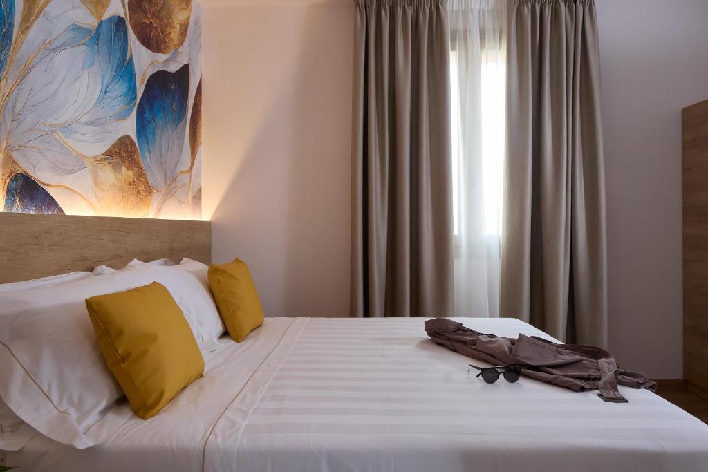 Postel nebo postele na pokoji v ubytování Luci di Assisi B&B Wellness