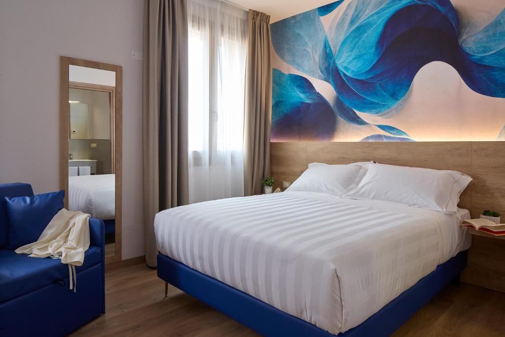 Postel nebo postele na pokoji v ubytování Luci di Assisi B&B Wellness