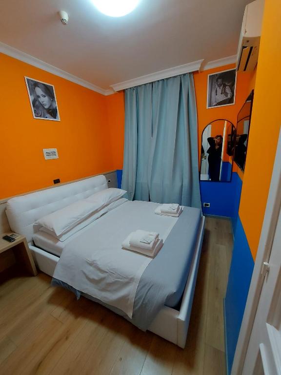 Postel nebo postele na pokoji v ubytování Hotel Positano