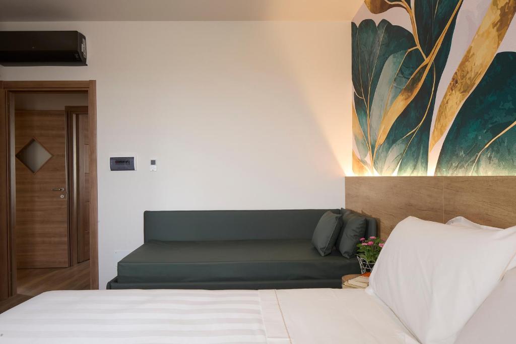 Postel nebo postele na pokoji v ubytování Luci di Assisi B&B Wellness