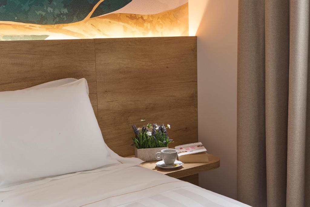 Postel nebo postele na pokoji v ubytování Luci di Assisi B&B Wellness