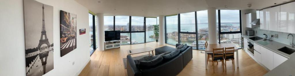 a living room with a couch and a table at Stunning 3-Bed 3-Bath Apartment in Southampton in Southampton