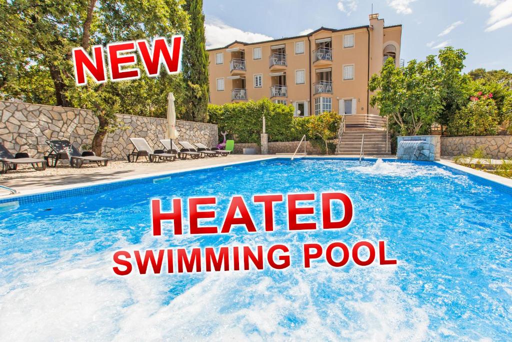 a new heated swimming pool with the text heated swimmingpool at B&B Pansion Vago in Malinska