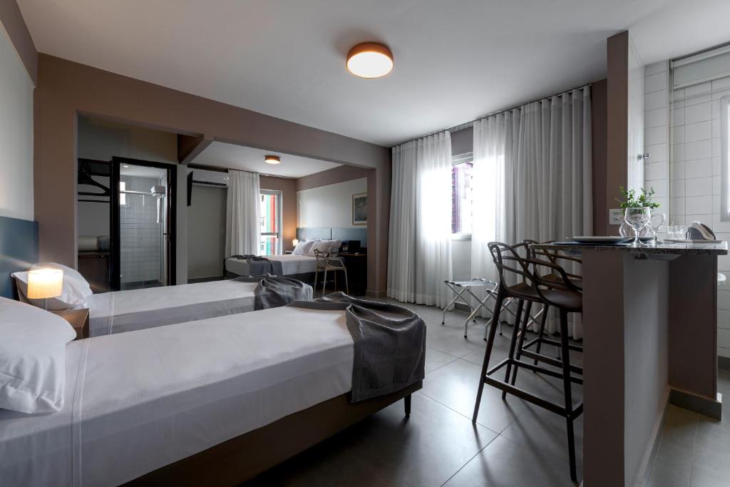 Postel nebo postele na pokoji v ubytování Lym Flat Hotel