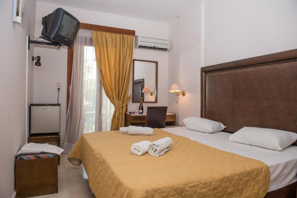 Postel nebo postele na pokoji v ubytování Verdelis Inn