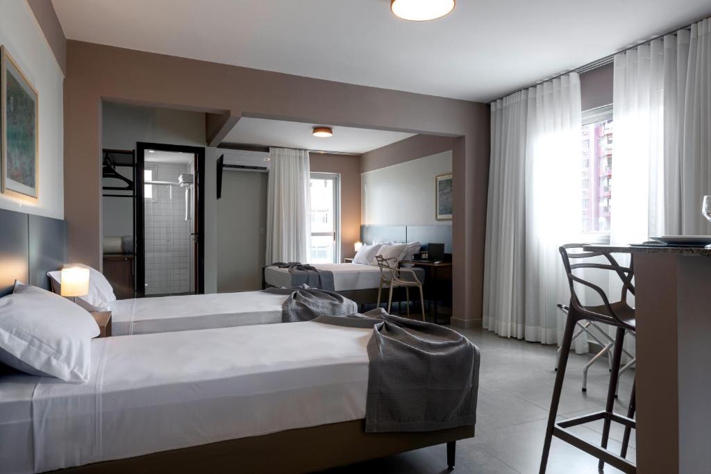 Postel nebo postele na pokoji v ubytování Lym Flat Hotel