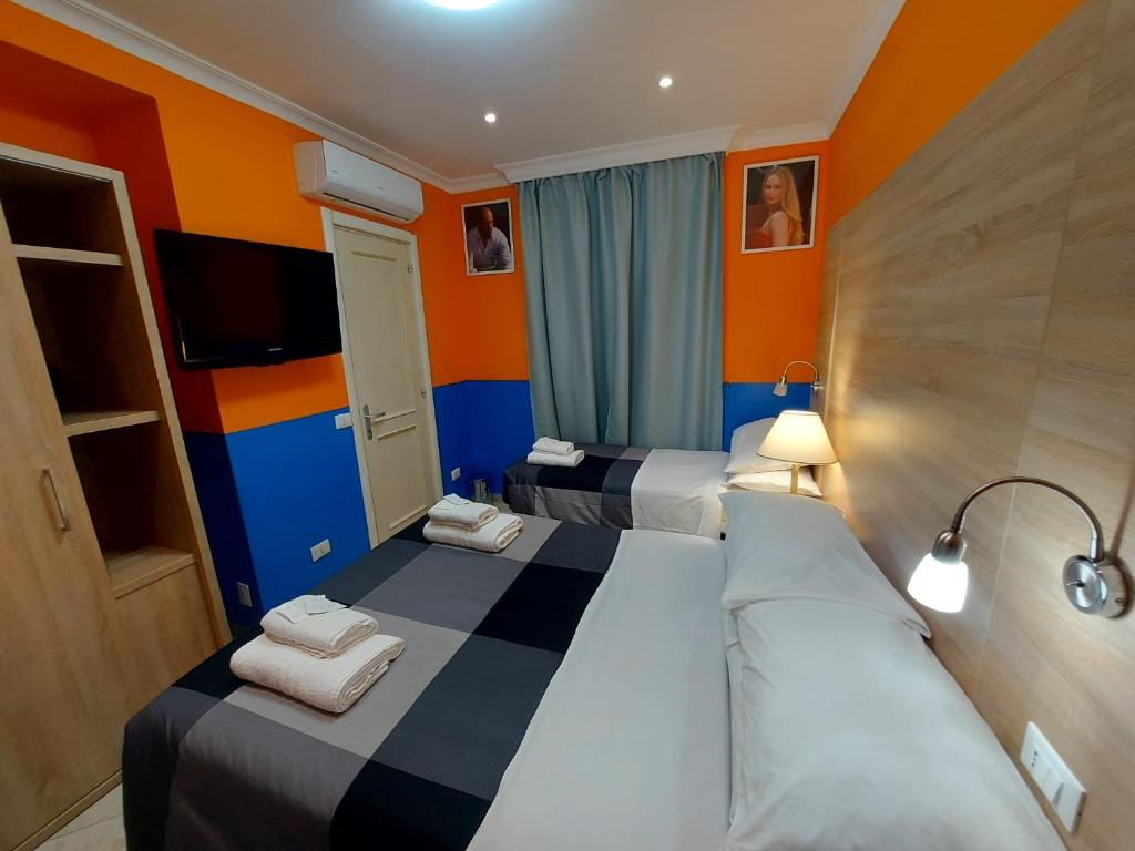 Postel nebo postele na pokoji v ubytování Hotel Positano
