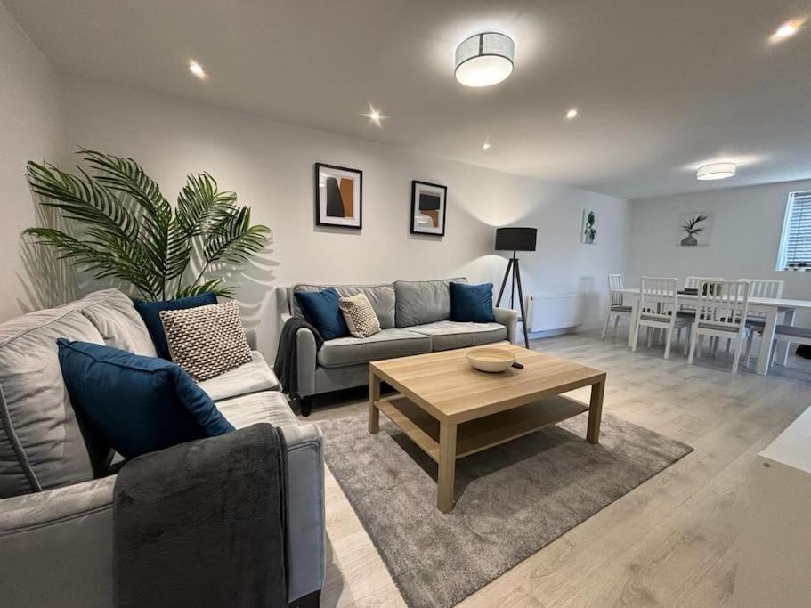 a living room with a couch and a coffee table at Open plan Shrewsbury Townhouse in Harlescott