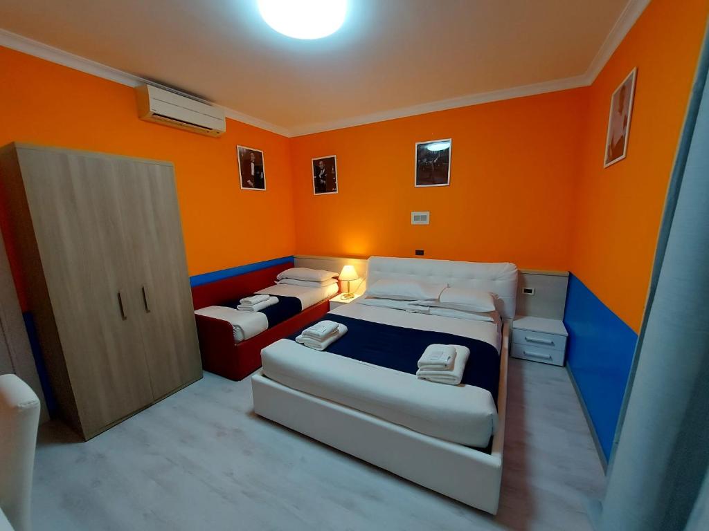 Postel nebo postele na pokoji v ubytování Hotel Positano