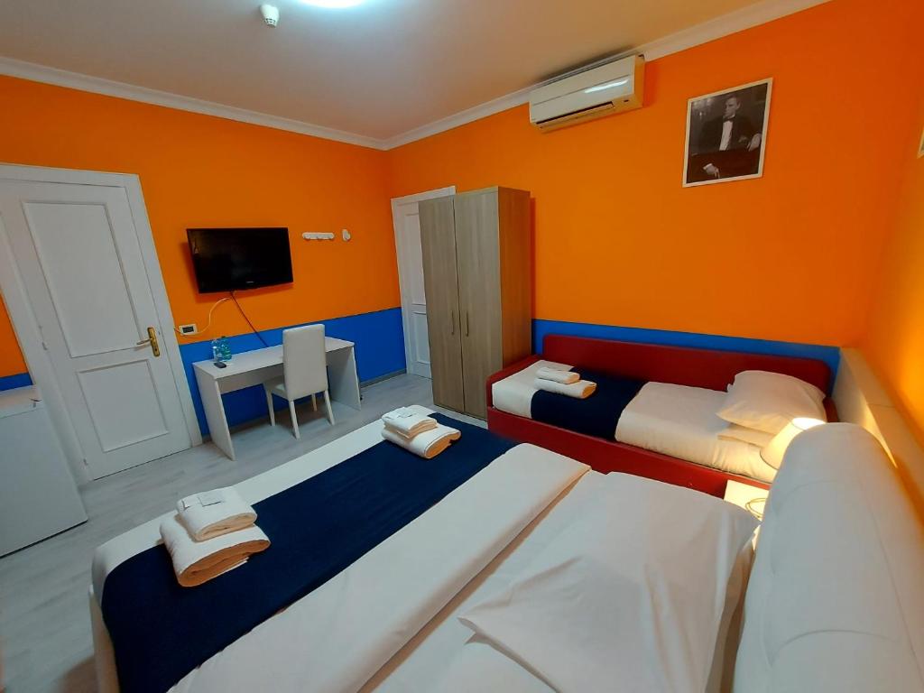 Postel nebo postele na pokoji v ubytování Hotel Positano