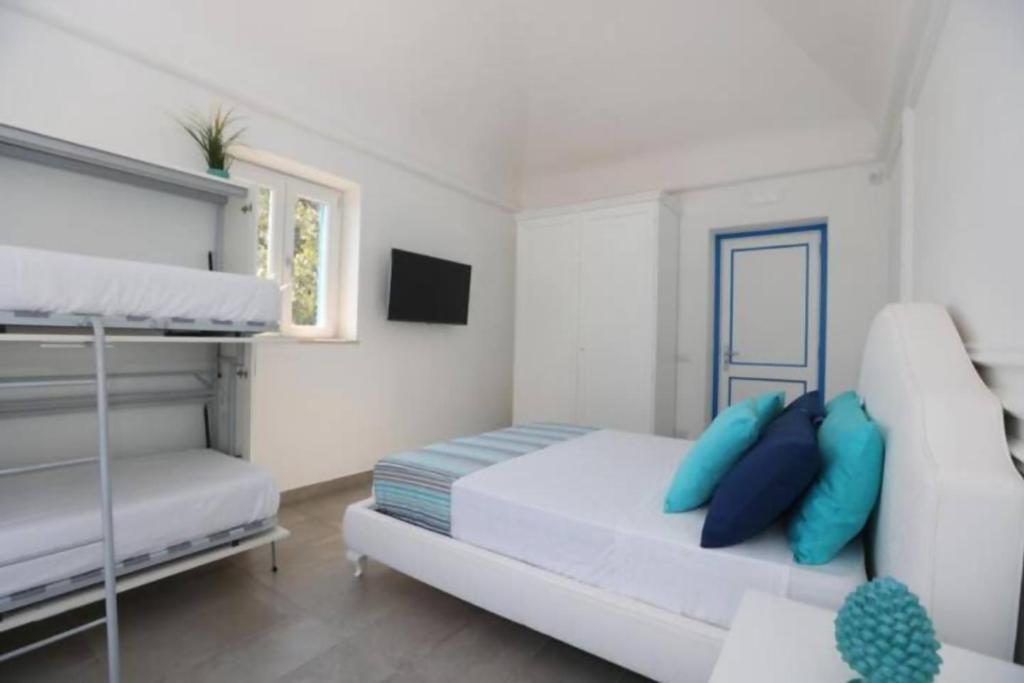 Postel nebo postele na pokoji v ubytování Villa Dei in Positano
