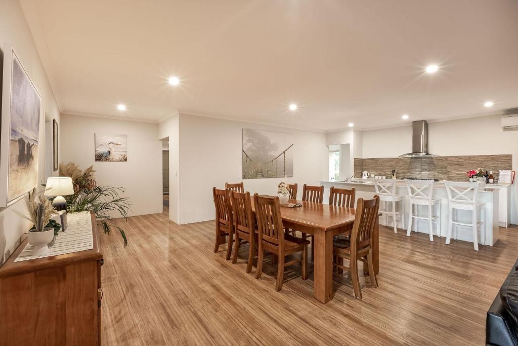 a dining room and kitchen with a table and chairs at Villa 16 @ Rivendell Winery Estate - Yallingup in Yallingup Siding