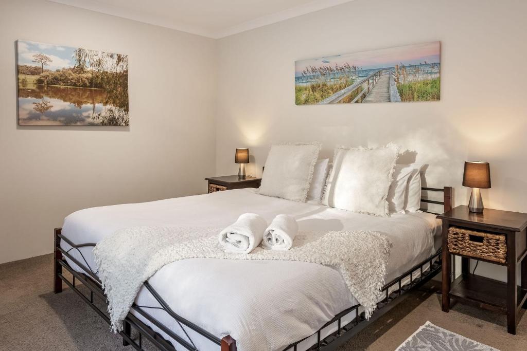 a bedroom with a bed with two towels on it at Villa 16 @ Rivendell Winery Estate - Yallingup in Yallingup Siding