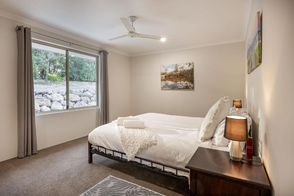 a bedroom with a bed and a window at Villa 16 @ Rivendell Winery Estate - Yallingup in Yallingup Siding