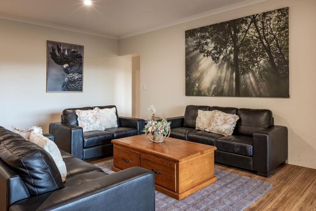 a living room with two couches and a coffee table at Villa 16 @ Rivendell Winery Estate - Yallingup in Yallingup Siding