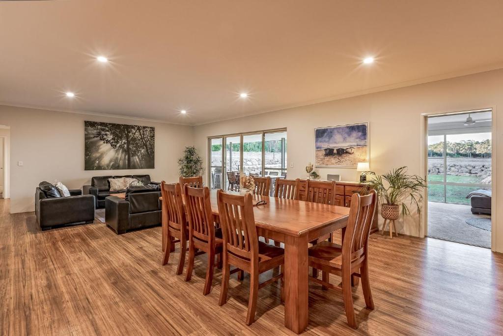 a dining room with a table and chairs at Villa 16 @ Rivendell Winery Estate - Yallingup in Yallingup Siding