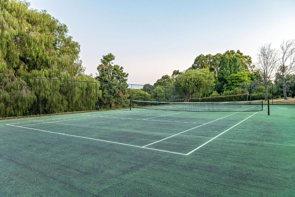 a tennis court with two tennis nets on it at Villa 16 @ Rivendell Winery Estate - Yallingup in Yallingup Siding