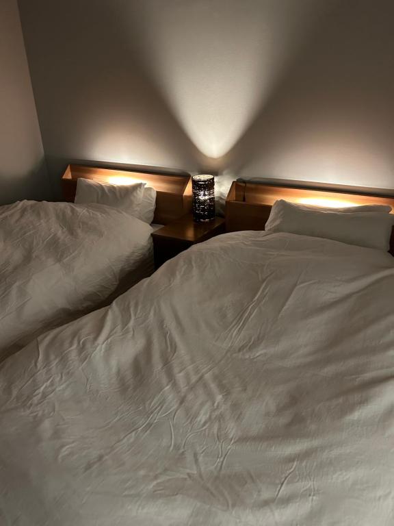 Postel nebo postele na pokoji v ubytování しまの宿 Island Country Inn